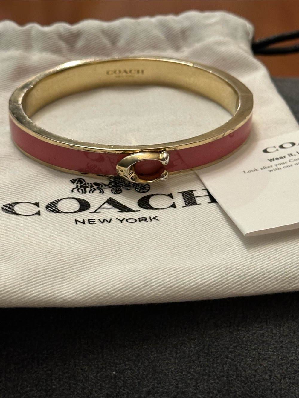 Coach Signature Gold-Tone Bangle with Pink Enamel Inlay